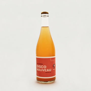 A large glass bottle of Little Pomona 'Disco Nouveau' cider