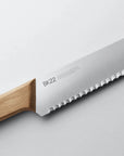 A close up image of a Veark wooden handled bread knife.