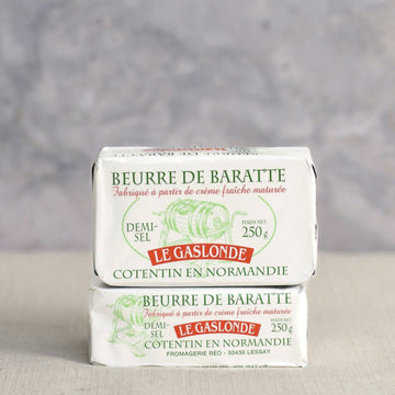 A two block stack of beurre de baratte butter.