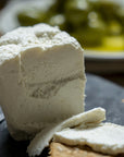 Ricotta cheese on a slate platter.