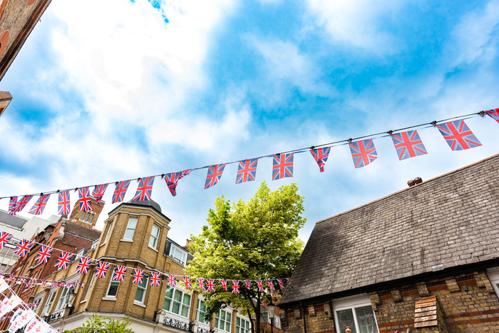 Rows of Union Jack bunting stretched across a street in Chelsea, London.