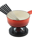 View of a cast iron fondue pot with forks on a rechaud stand.