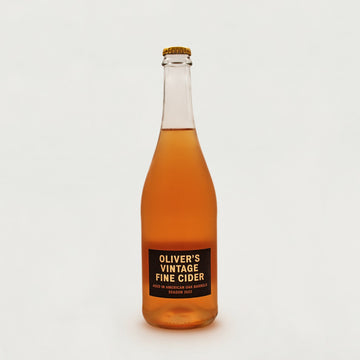 A large glass bottle of Oliver's Vintage Fine Cider.