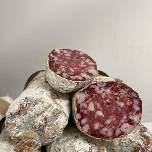 Slices of cured meat with a white background