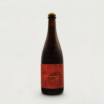 Bottle with a red label on a light grey background.