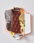 An open packet of Pump Street Madagascar milk chocolate.