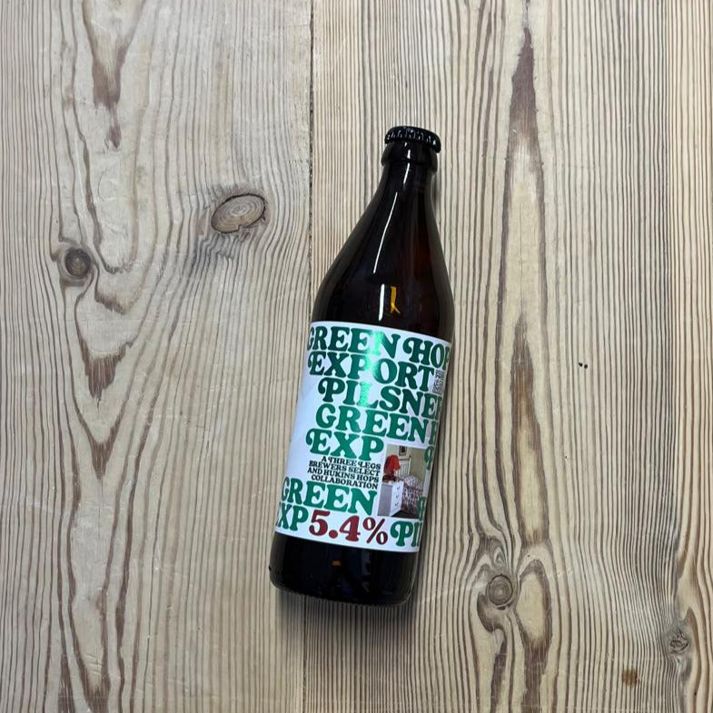 A 500ml glass bottle of Three Legs Green Hop Export Pilsner beer.