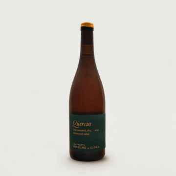 Bottle of Quercus cider with a green label on a white background.