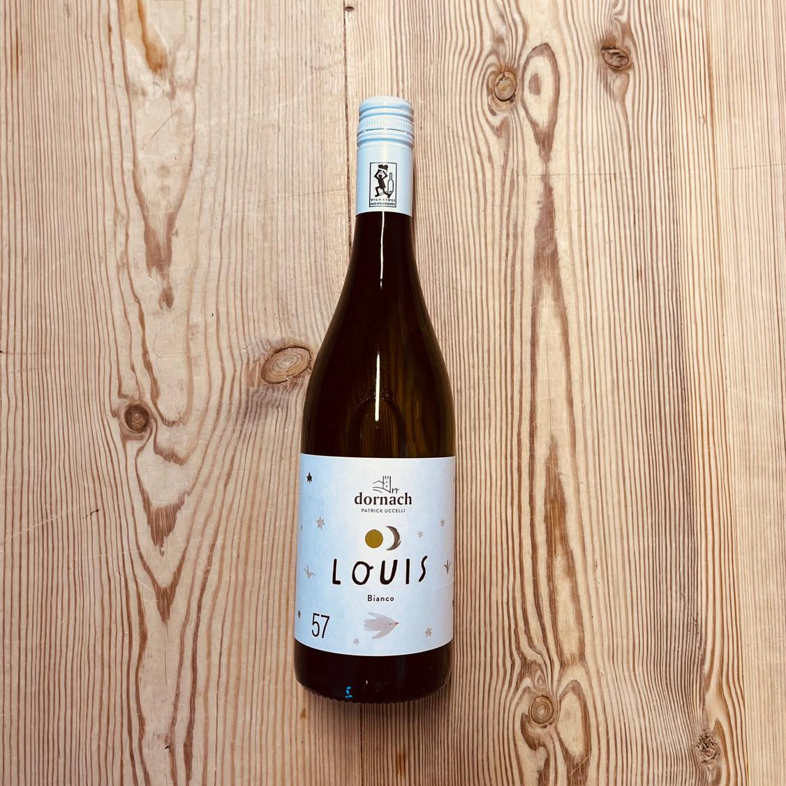 Wine bottle labeled 'Louis' on a wooden surface
