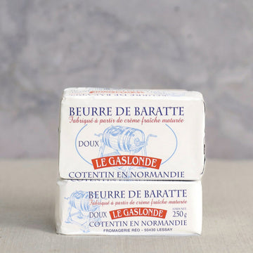 A two block stack of beurre de baratte unsalted butter.
