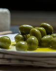 A plate of green olives.