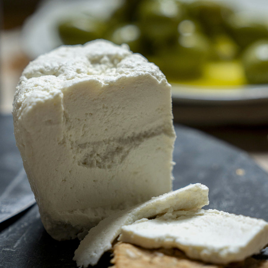 Ricotta cheese on a slate platter.