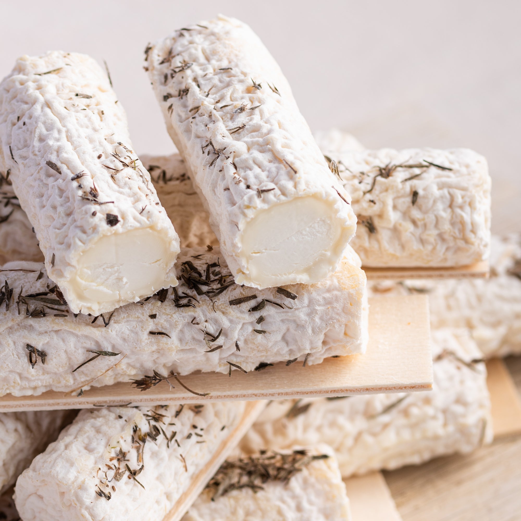 Close up of Buchette de Manon cheeses.