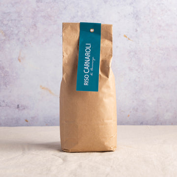 A brown paper packet of Carnaroli risotto rice.