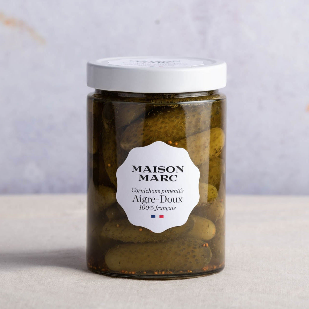 A jar of Maison Marc aigre-doux cornichons.