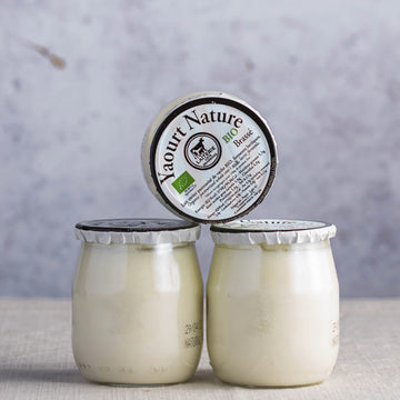 Glass jars of French organic natural yoghurt.