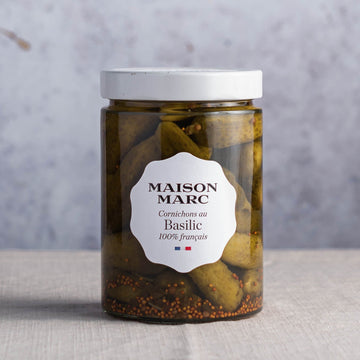 A jar of maison marc basil infused cornichons.