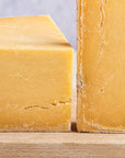 A close up of pieces of Montgomery's Cheddar.