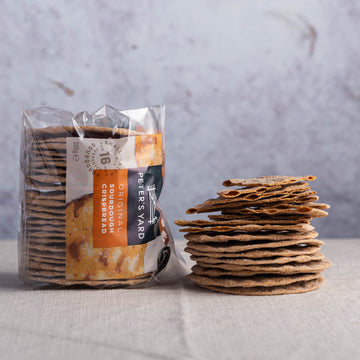 A stack of peters yard sourdough crackers.