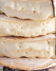 Cut pieces of creamy, oozing Little Rollright cheese.