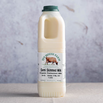 A plastic bottle of Ivy House Farm organic semi-skimmed milk.