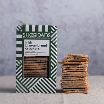 A stack of sheridans brown bread crackers and their box.