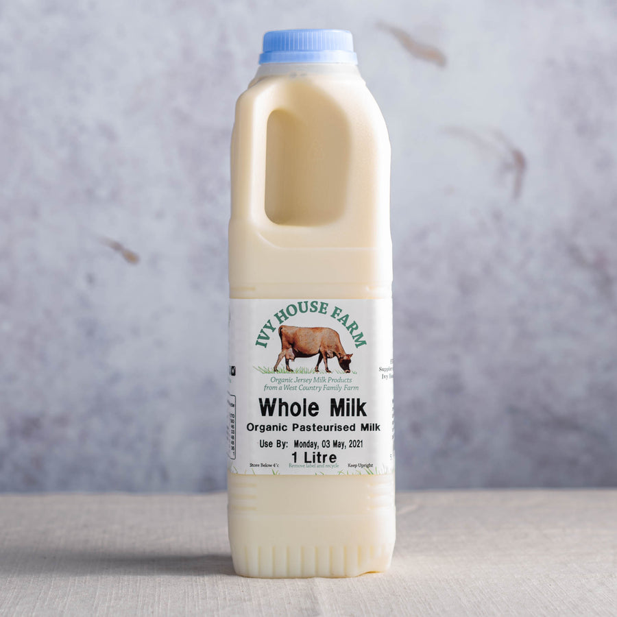 A plastic bottle of Ivy House organic whole cow's milk.